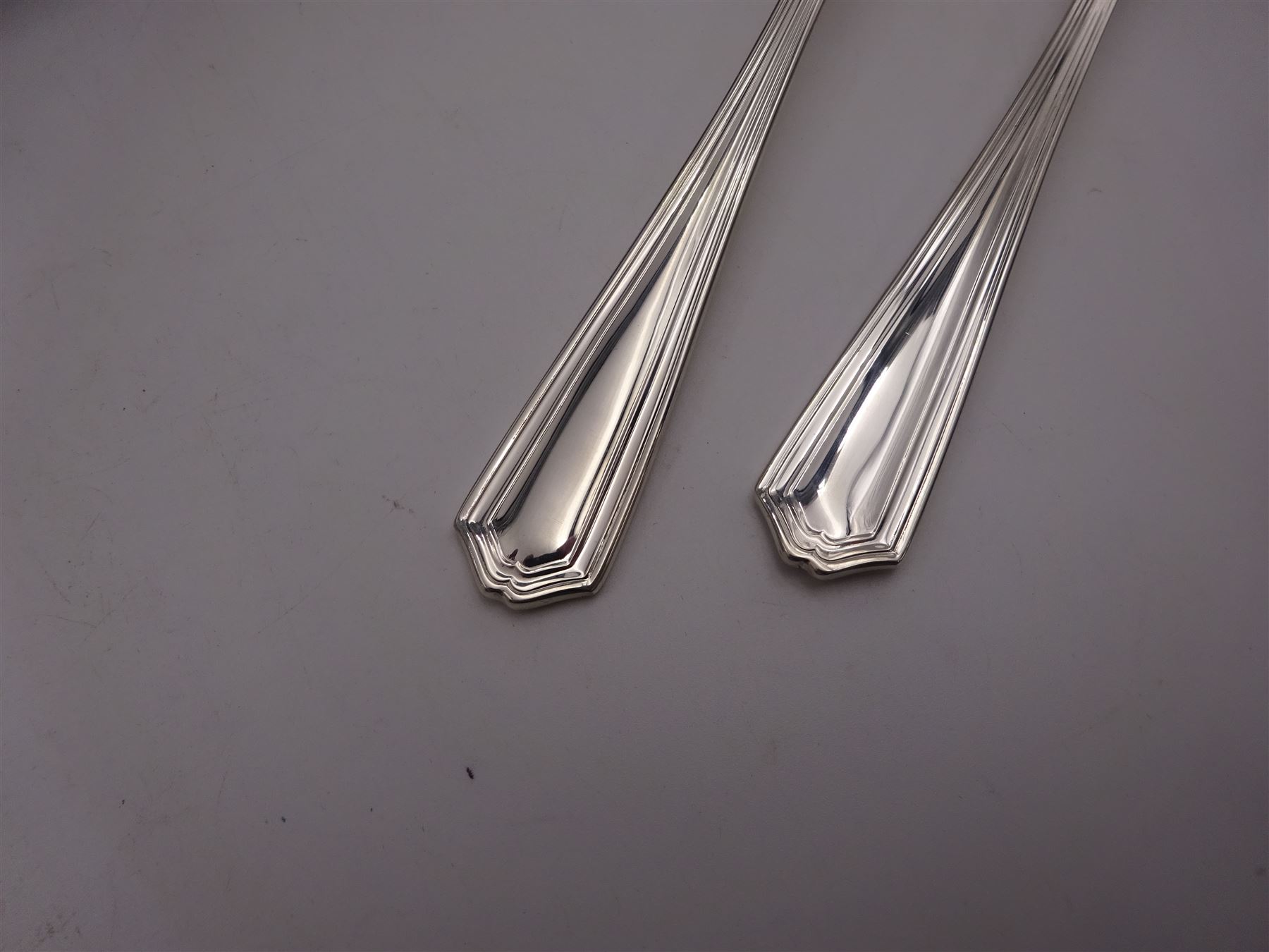 Modern silver Chester pattern flatware for six place settings, comprising table knives, table forks, dessert knives, dessert forks, dessert spoons, soup spoons, teaspoons and two serving spoons, hallmarked United Cutlers Ltd, Sheffield 1998
