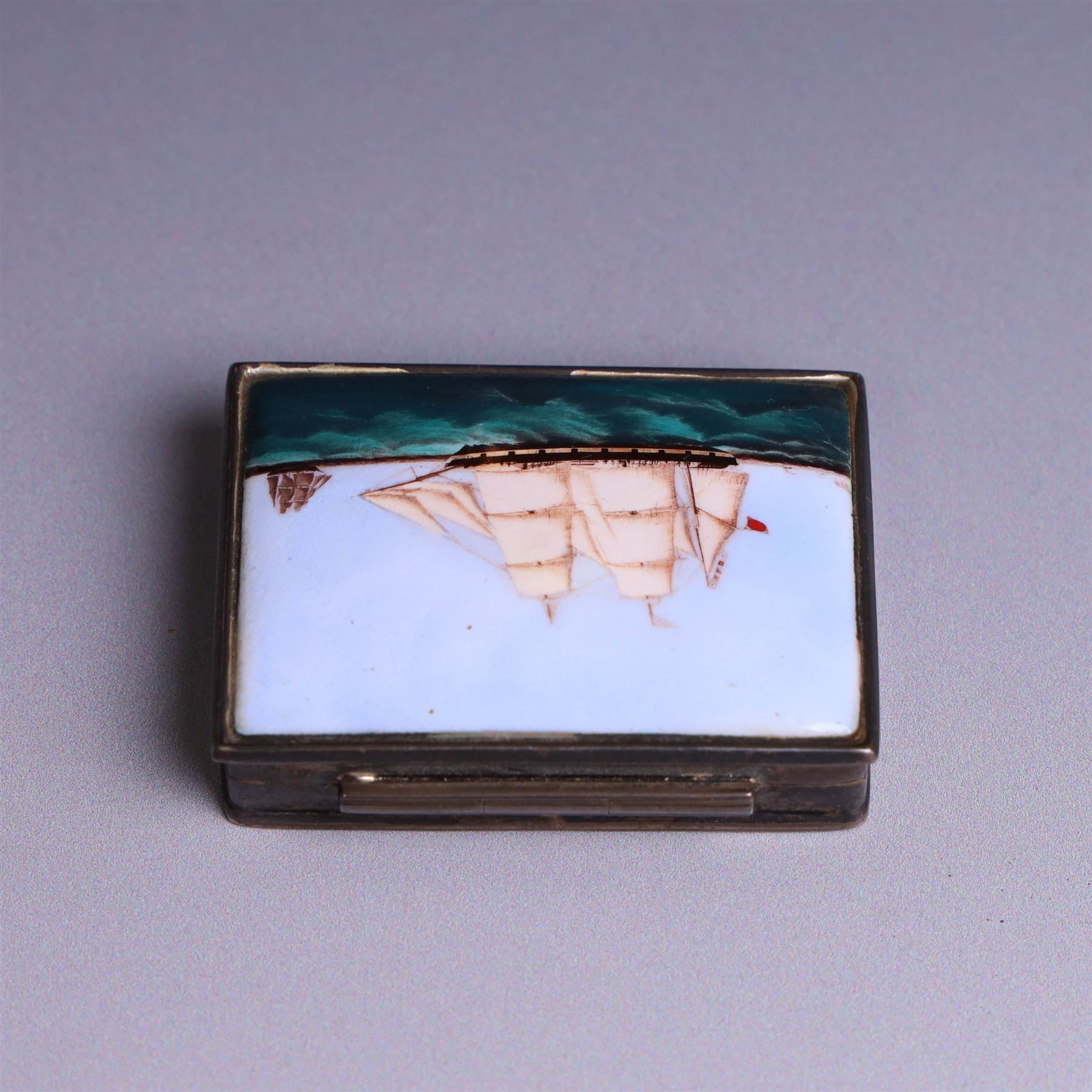 Modern silver box, with enamel plaque to hinged lid depicting a ship at full sail, stamped 925