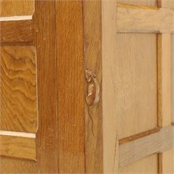 Mouseman - oak sideboard with adzed top and raised gallery back, over two short drawers and three long drawers, flanked by panelled cupboard doors with wrought iron fittings, on octagonal feet, carved with the signature mouse to the right-hand door