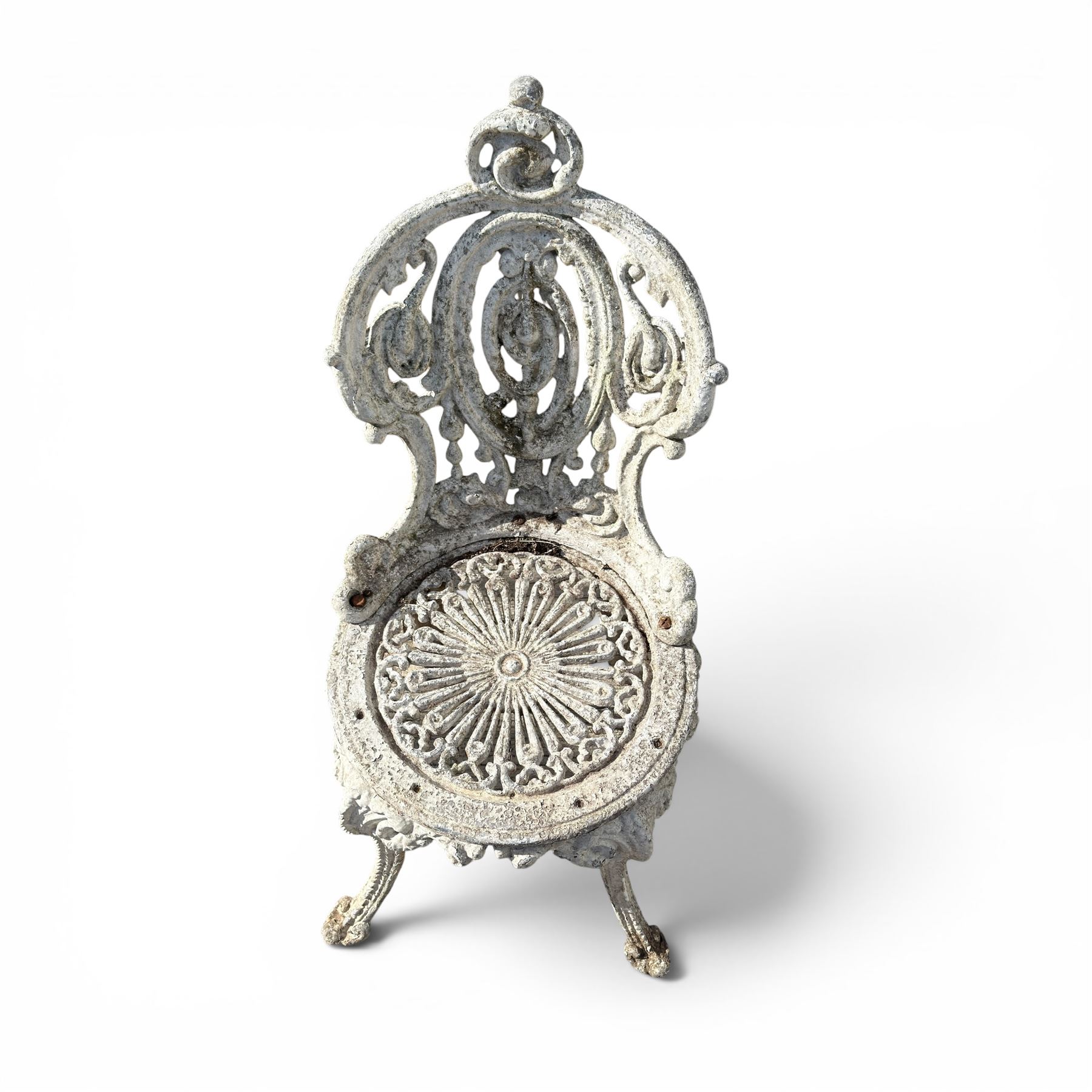 Pair of white painted cast metal garden chairs, ornate reclined backs, circular pierced seats on cabriole legs