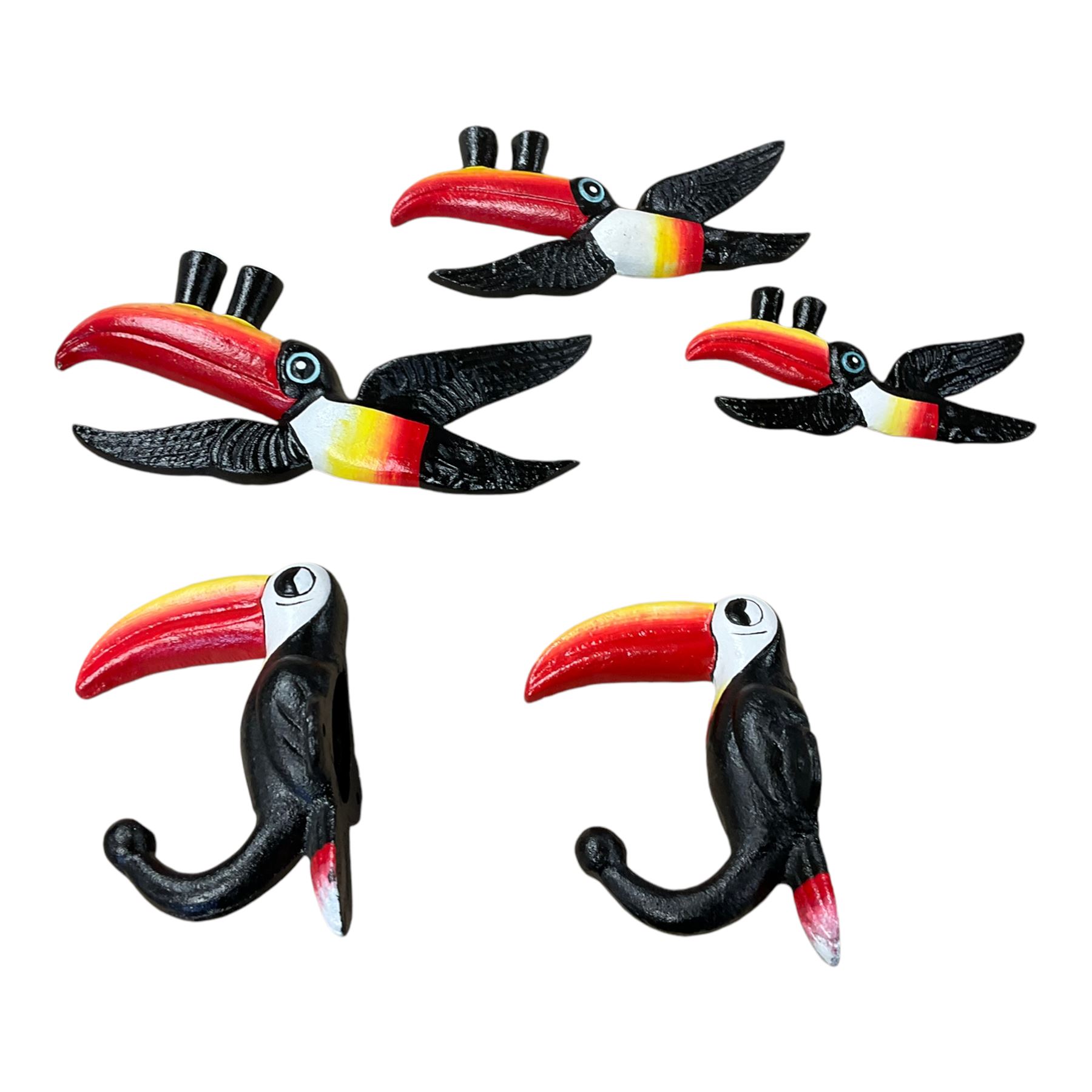 Three cast iron Guinness toucans in flight, together with two cast iron hooks