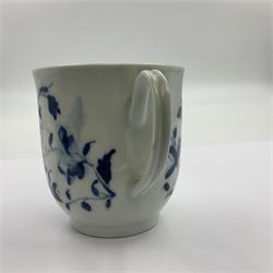 Two 18th century Worcester porcelain coffee cups, the first example decorated in the Plantation pattern, circa 1754, the second decorated in the Mansfield pattern, circa 1760, with workman's mark beneath, each approximately H5.5cm