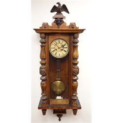  Victorian Vienna walnut wall clock with eagle cresting, Roman dial and twin train movement striking the half hours on a gong, H111cm  