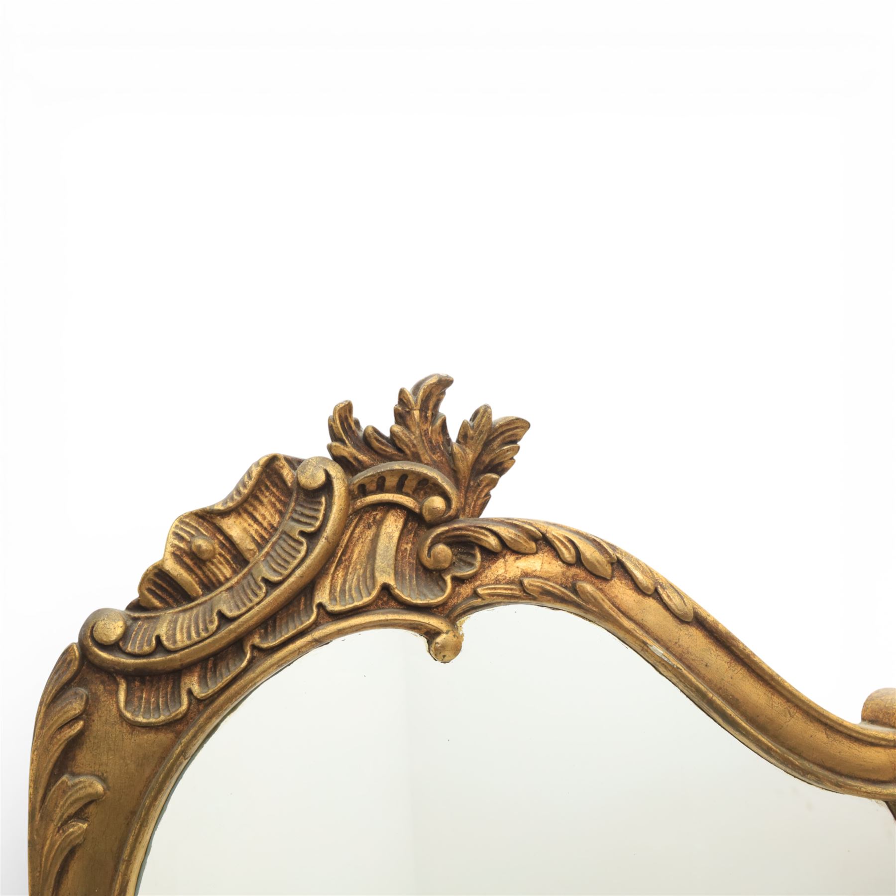 Rococo style giltwood three-panel dressing screen, each panel with shaped and scroll carved frame decorated with shell and foliate motifs, the upper sections glazed, the lower sections upholstered in patterned fabric, hinged to form a folding screen