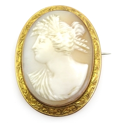 Cameo brooch in scrolled 9ct gold surround stamped 9ct 5cm