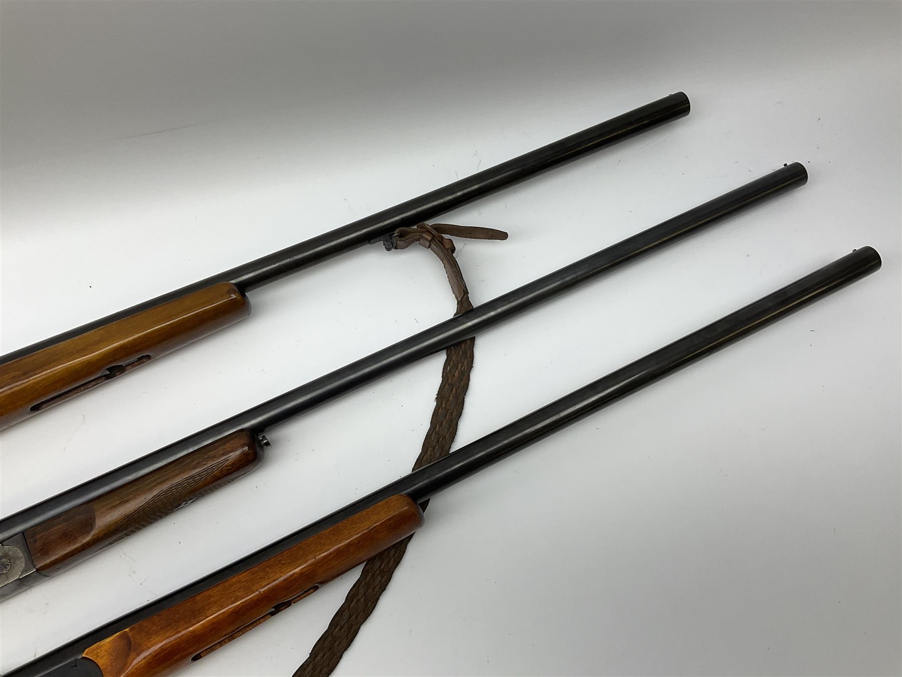 Three 12-bore single barrel sporting guns - Russian Baikal with 72.5cm barrel and underlever opening, serial no.Y17440, L114cm overall; Russian Baikal with 72.5cm barrel and underlever opening, serial no.A23484 L114cm overall; and Spanish with 76.5cm barrel and top lever opening, serial no.38996MU L118.5cm overall (3) SHOTGUN CERTIFICATE REQUIRED