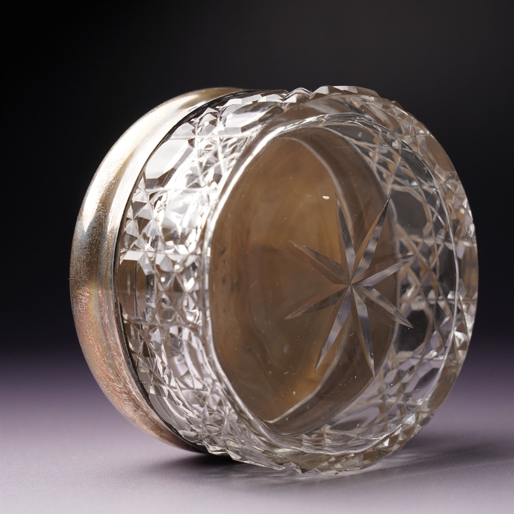 Silver topped glass trinket jar, small circular photograph frame and dessert fork