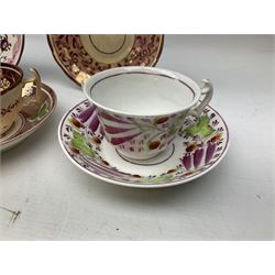 Three 19th century porcelain pink lustre teacups, together with two other saucers 
