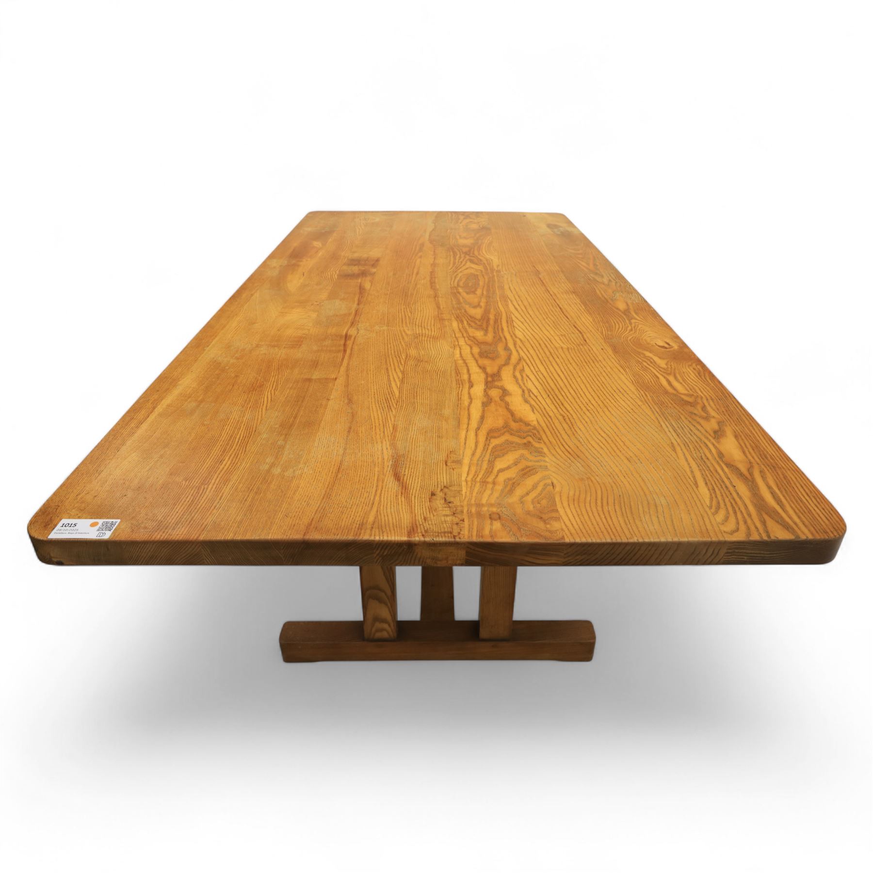 Treske of Thirsk - solid oak refectory dining suite, rectangular top with chamfered edge over trestle base united by a central stretcher, together with six matching slat back dining chairs, including two carvers, with panelled seats and square legs united by stretchers (H 87cm, W 62cm, D 57cm)