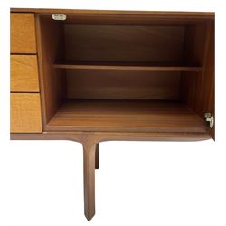 Mid-20th century teak sideboard, fitted with three central drawers flanked by cupboards