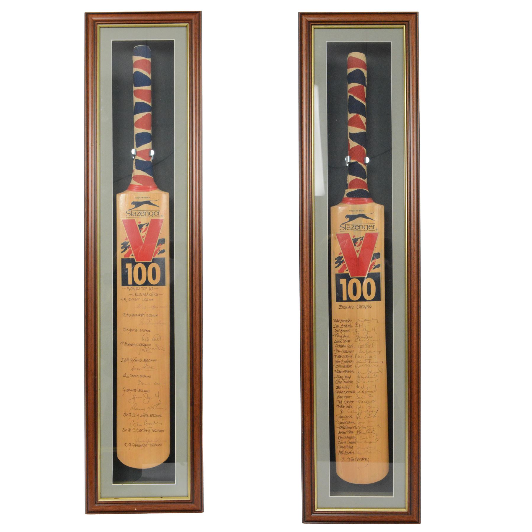 Two signed Slazenger V 100 cricket bats, the first example signed by the 'World's Top 10 Run Makers', with signatures including Graham Gooch, David Gower, Geoffrey Boycott, Gary Sobers and Viv Richards, the second example signed by a number of England's Cricket Captains, including Alec Stewart, Ken Cranston, Bob Willis, Allan Lamb, Mike Atherton and Ian Botham etc, both within glazed wooden display cases, case H99cm