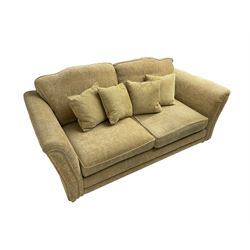 Three seater sofa, upholstered in cream fabric