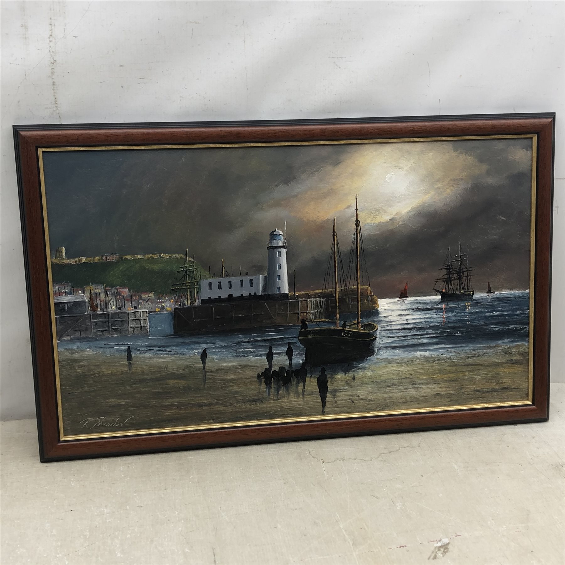 Robert Sheader (British 20th Century): Scarborough Lighthouse at Low Tide, oil on board signed 34cm x 60cm