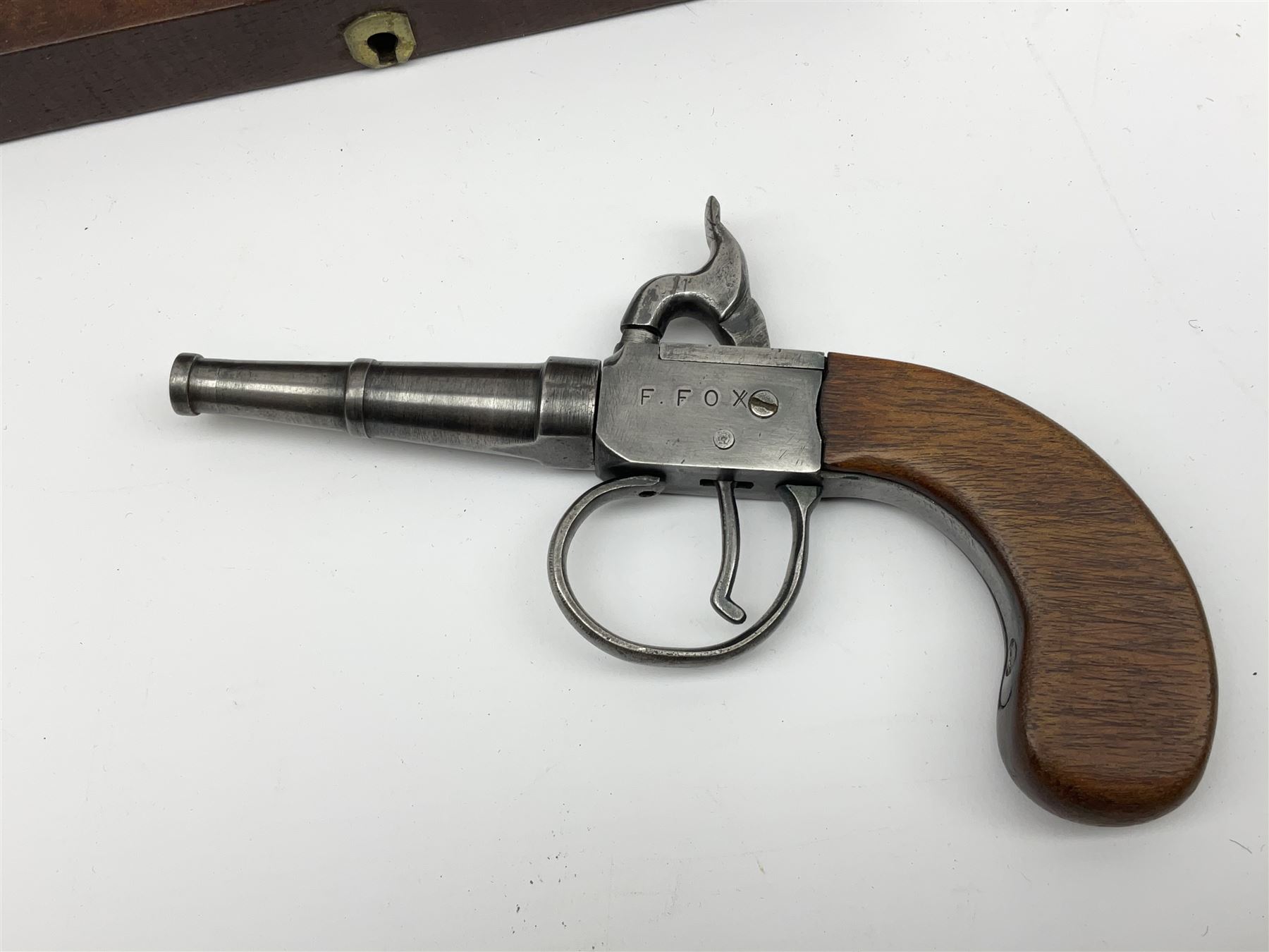 Scratch-built copy of a 19th century percussion cap pistol with 7cm tapering cannon style turn-off barrel, lock-plate inscribed 'F. Fox' and mahogany bag stock L17.5cm overall, in fitted mahogany box with inlaid crest chased mother-of-pearl cartouche and double-ended spanner