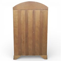 Early 20th century Art Deco bedroom suite, comprising double wardrobe, dressing table and chest of drawers, constructed in walnut with figured veneers and geometric banding, the wardrobe with arched top and panelled doors enclosing a fitted interior, the dressing table with rectangular top below a three panel mirror arrangement, fitted with two short over two long drawers, the chest with three short and three long drawers, each piece fitted with faceted handles and raised on shaped feet
Wardrobe (H 177cm, D 46cm, W 112cm)
Chest (H 85cm, D 48cm, W 92cm)
Dressing table (H 160cm, D 52cm, W 106cm)
