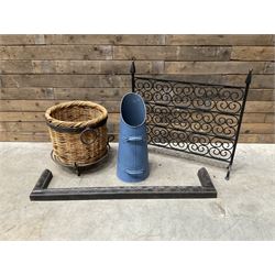 Black painted wrought iron fire guard , wicker log basket with stand, coal bucket and a fi...