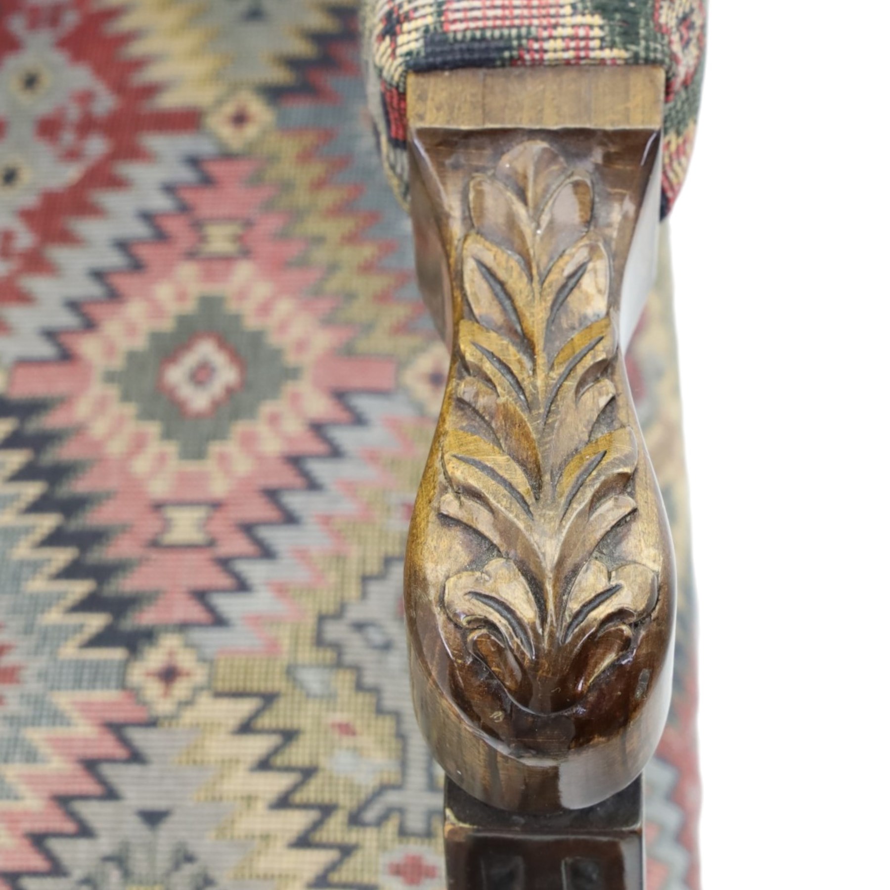 Chippendale design Gainsborough elbow chair, upholstered in kilim fabric, blind fretwork and acanthus carving