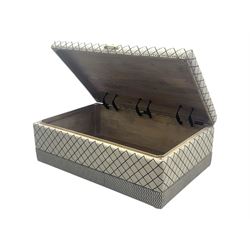 Oka - contemporary mango wood upholstered ottoman, rectangular frame with a printed cotton dhurrie featuring a diamond pattern and wavy stripe border, fitted with brass hinges, decorative studs, and handle