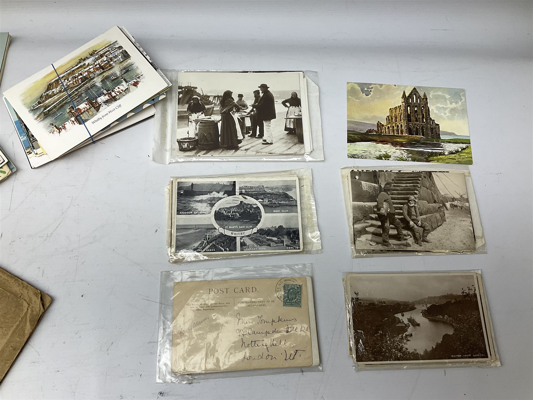 Quantity of books and postcards predominantly of Whitby interest including Hornes' Guide to Whitby 1890 and Hornes' Tourist map of Whitby, A Holiday Tour in and Around Whitby by H.S. Forman 1896 etc