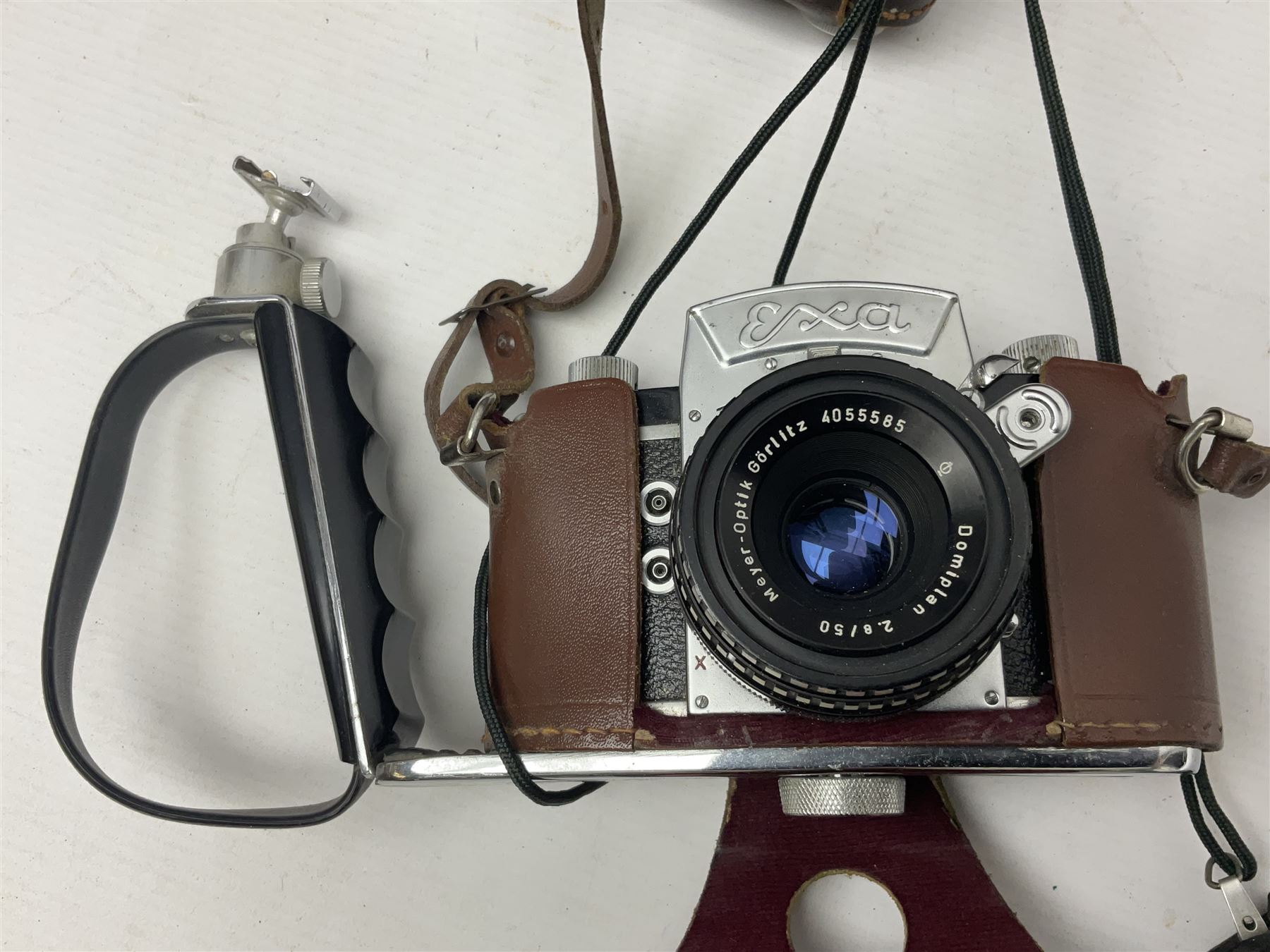 Collection of cameras and lenses, to include Pentax Program A camera body, serial no 123759, with 'Pentax-A zoom 1:3.5-4.5 28-80mm' len, Praktica EE2 camera body with 'Pentacon electric 1.8/50' lens etc, together with a Manfrotto tripod 