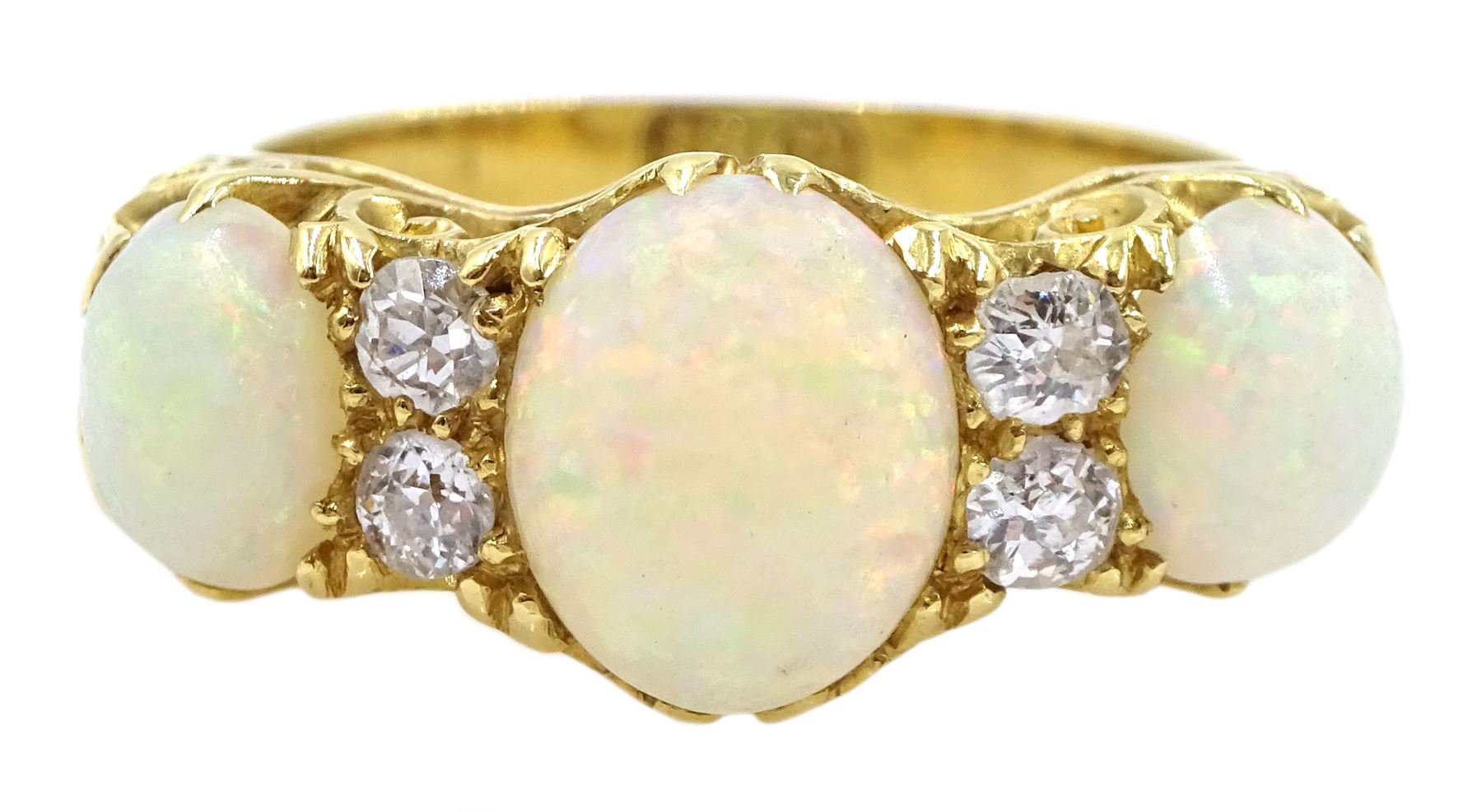 Early 20th century opal and diamond ring, three oval opals with four ...