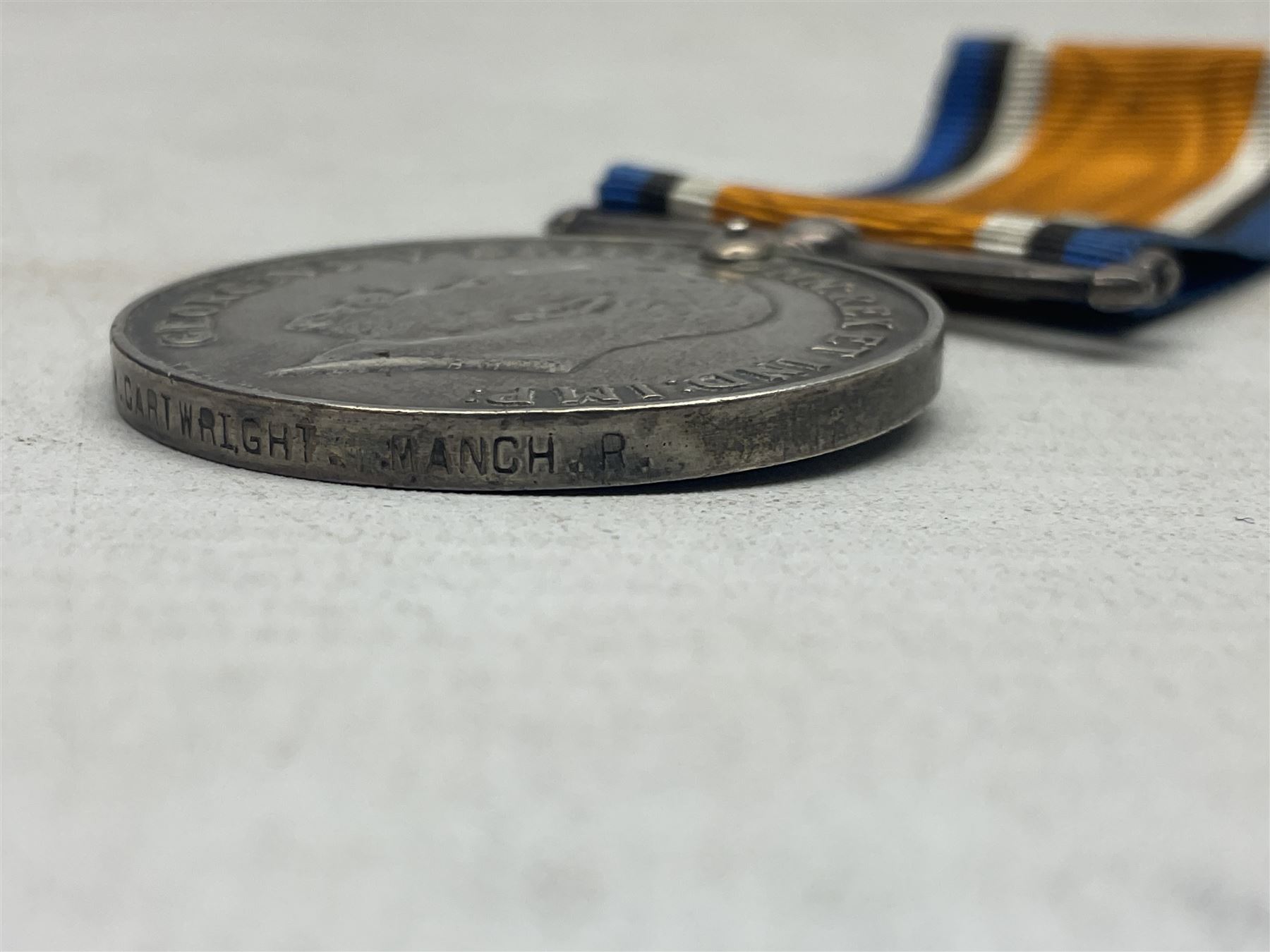 WW1 group of three medals comprising British War Medal, 1914-15 Star and Victory Medal awarded to 1781 Pte. W. Cartwright Manch. R.; and another WW1 British War Medal awarded to 30284 Pte. W.H. Paterson Manch. R.; all with ribbons (4)