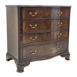 Early 20th century Georgian style mahogany serpentine chest, the moulded top over four graduating drawers, canted fluted corners, on ogee bracket feet