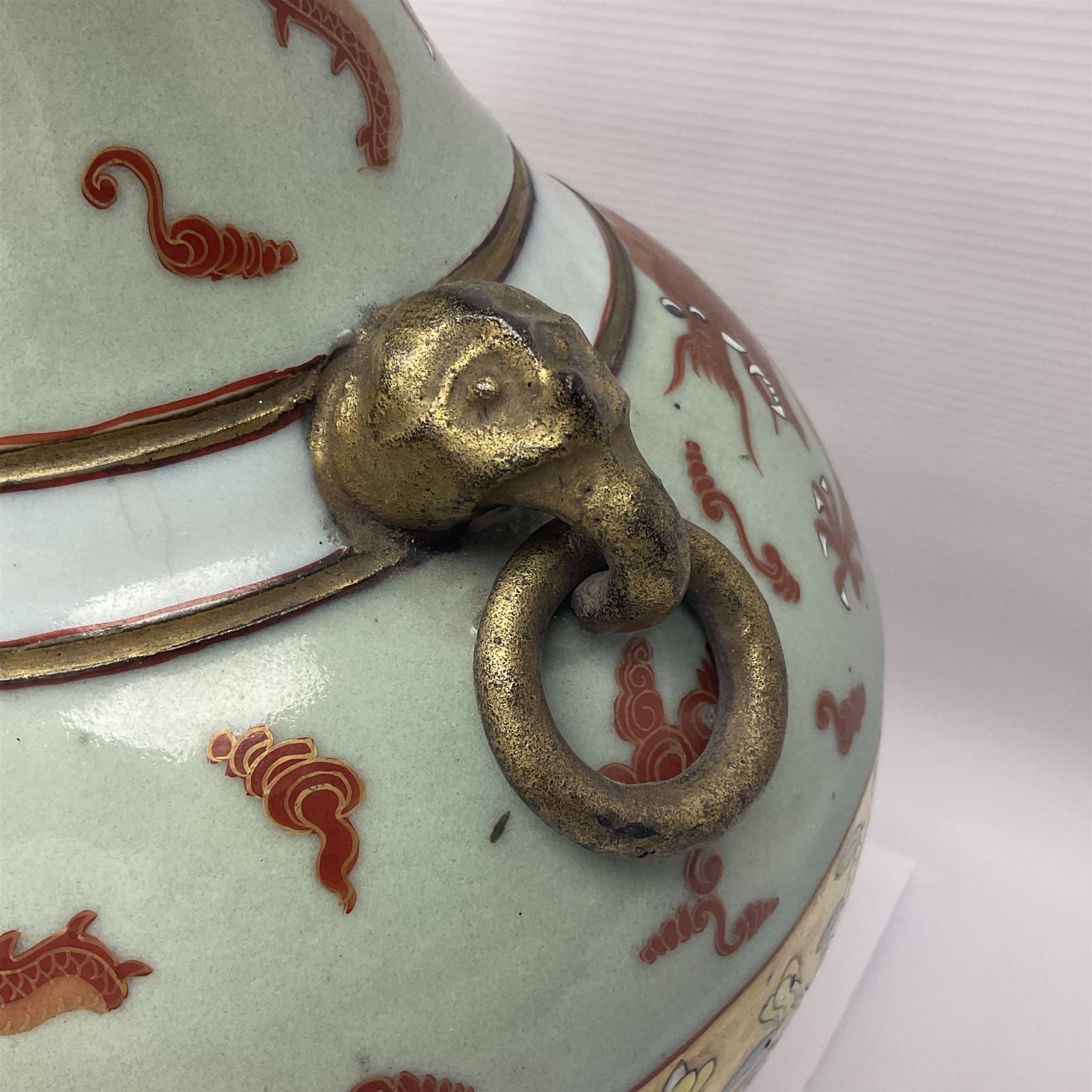 Pair of early 20th century Chinese vases decorated with dragons chasing a flaming pearl, with a gilt border of butterflies and floral sprigs, with Elephant head handles, H44cm 