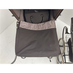 Pair of 1980s Silver Cross brown coach built dolls prams; each with folding canopy and apron, tubular framework with suspension, spoked wheels with brake and luggage rack and separate matching shopping bag L93cm