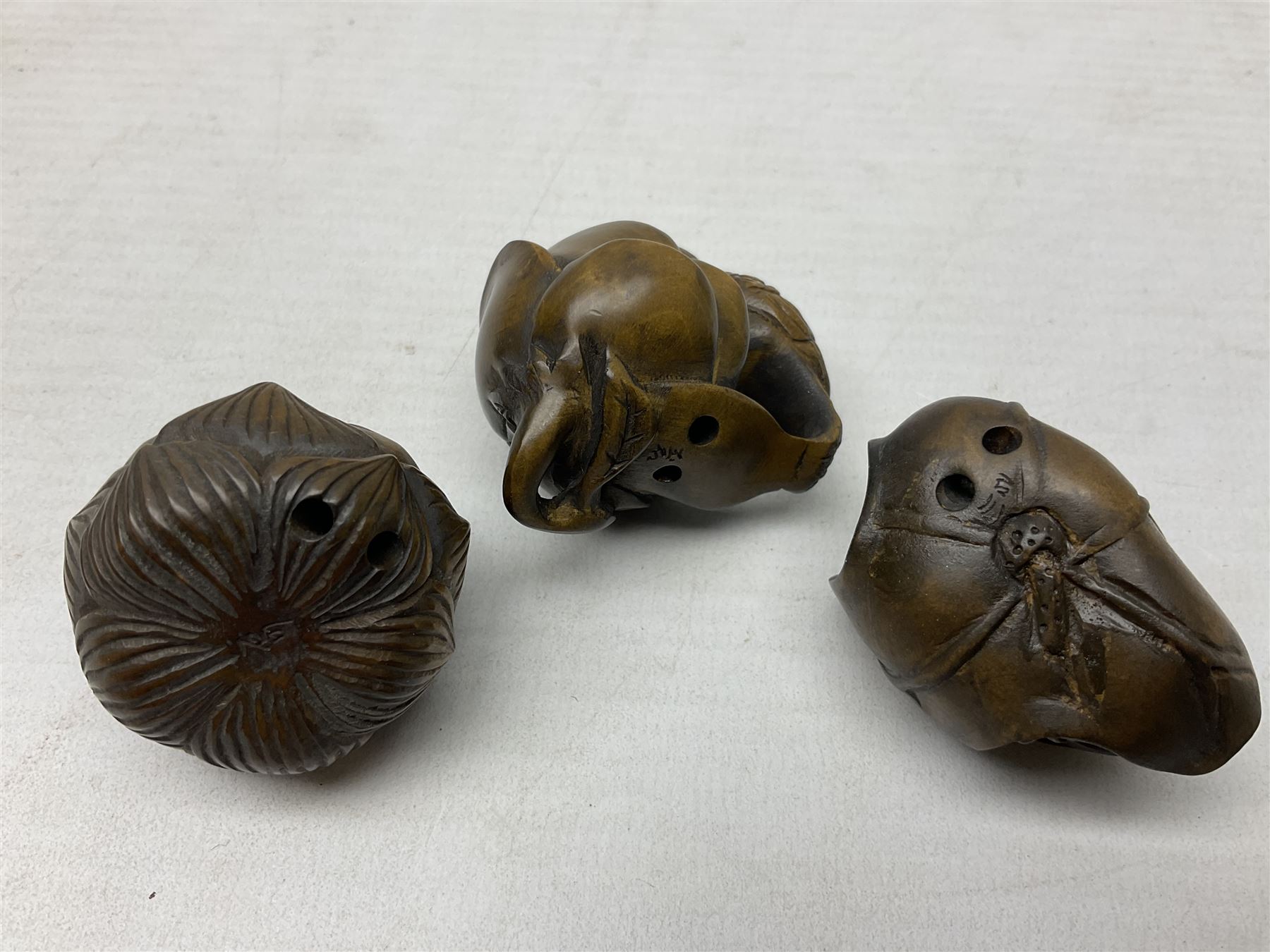 Six netsuke, modelled as a lizard, cricket, frog, bird on a flower, turtle and insect