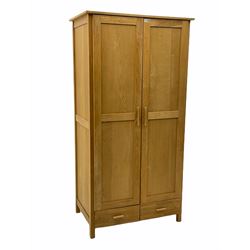 Solid oak double wardrobe, fitted with two drawers to base