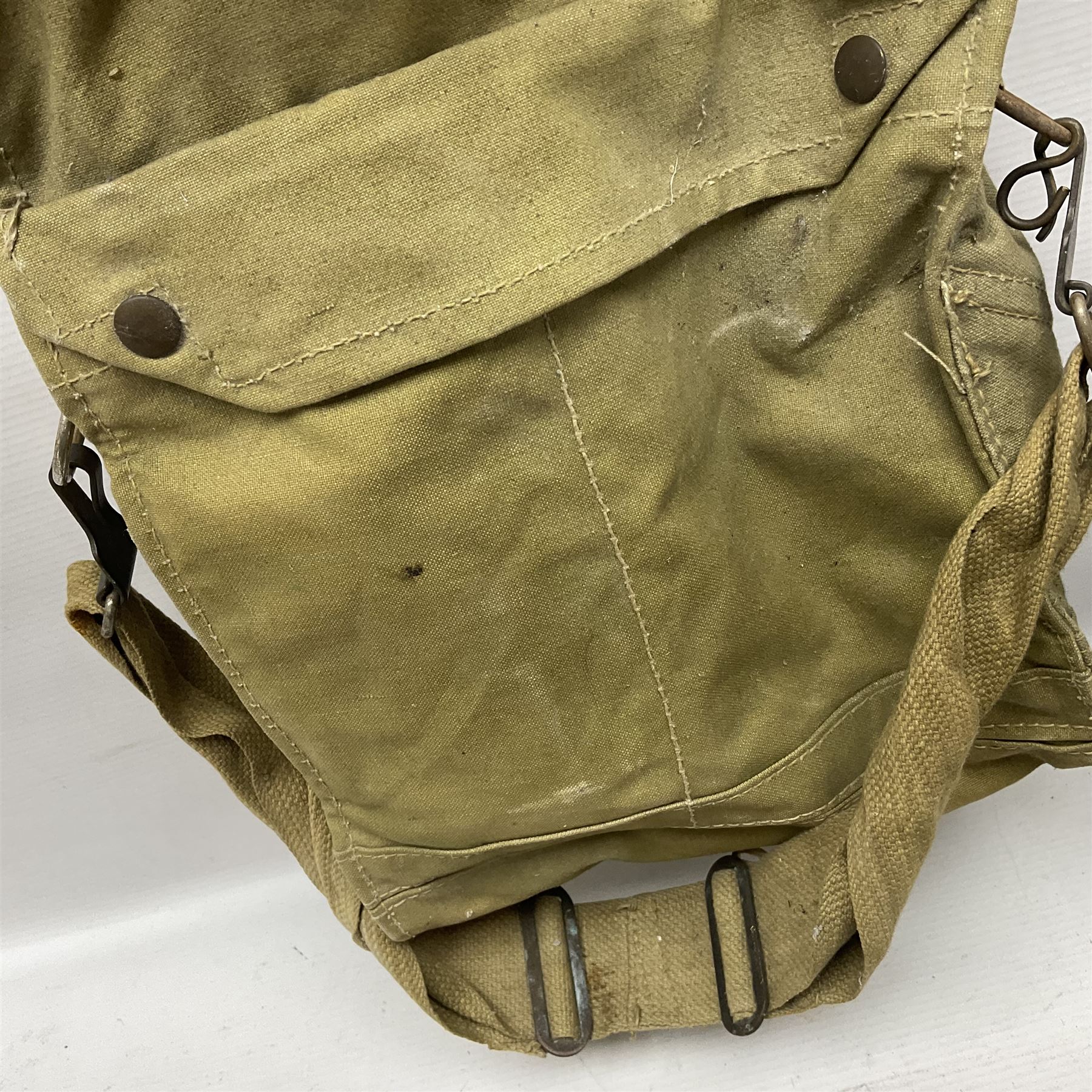 1970s British turtle style steel helmet with liner, green cover and netting; liner marked C.W.L. 1972 No.8415-99-973-6750; size 6 3/4 - 6 7/8; WWII respirator dated 1941 in canvas carrying case; and a Native long-shafted spear with iron head and bound plain round haft L165cm (3)