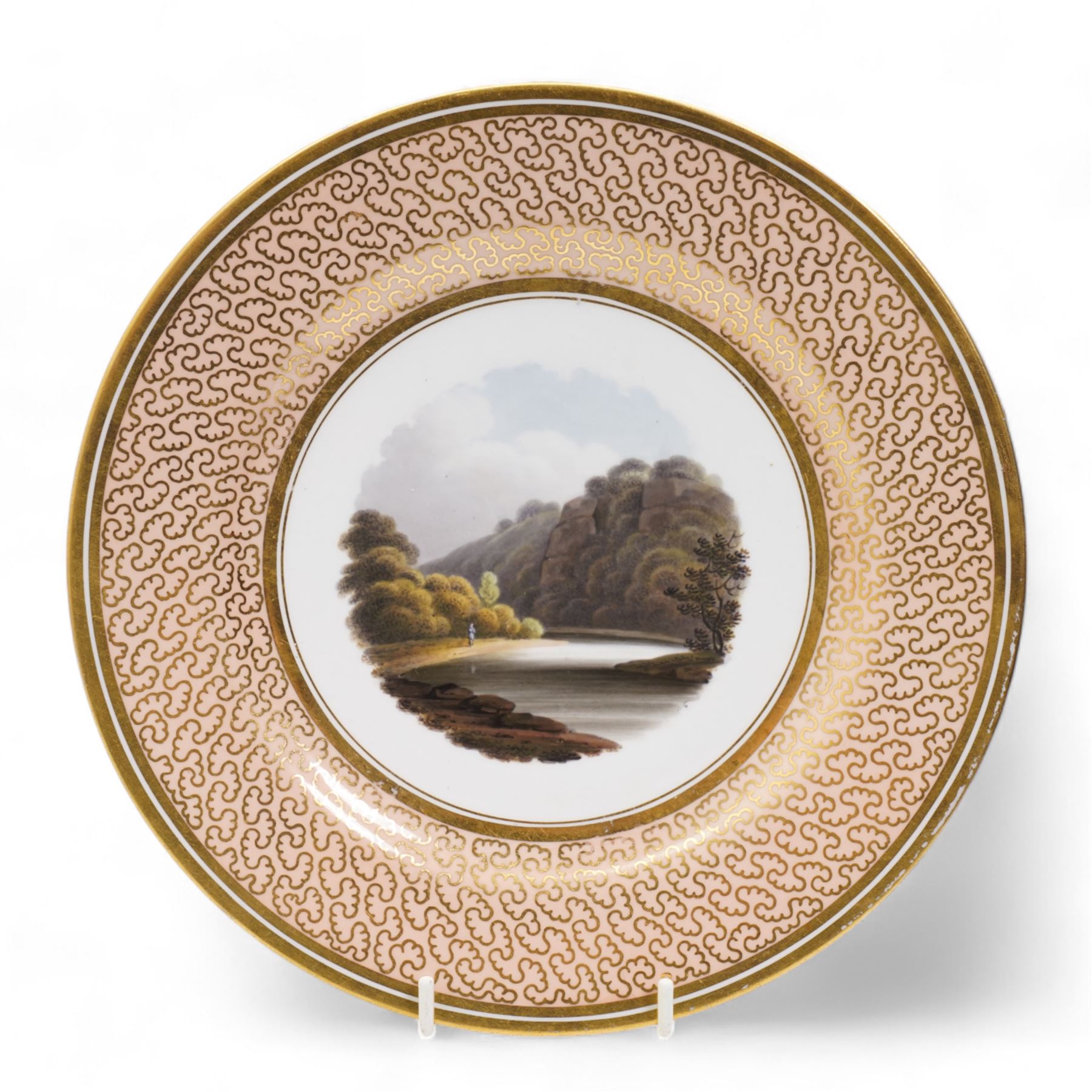 Flight, Barr & Barr Worcester porcelain cabinet plate, centrally painted with two figures admiring the landscape, within a gilt seaweed border, printed marks beneath, D22.5cm, together with a Barr, Flight & Barr Worcester cabinet plate, painted with a view of the River Esk, Scotland', within a peach and gilt seaweed border, titled 'On the River Esk - Scotland' and printed marks beneath (2)