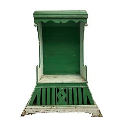 19th century painted pine hen coop settle, overhanging arched canape with dentil moulding and shaped edge, the panelled seat over a triangular platform base with removable hen-coop door, in green and white finish