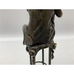 Art Deco style bronze modelled as a female figure, holding her knee, seated upon a chair, after 'Pierre Collinet', H28cm