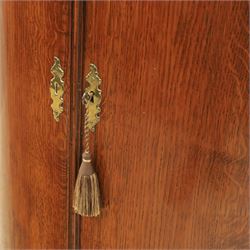 George III oak and mahogany wall hanging cylinder corner cupboard, moulded cavetto cornice over double cupboard enclosing three shelves