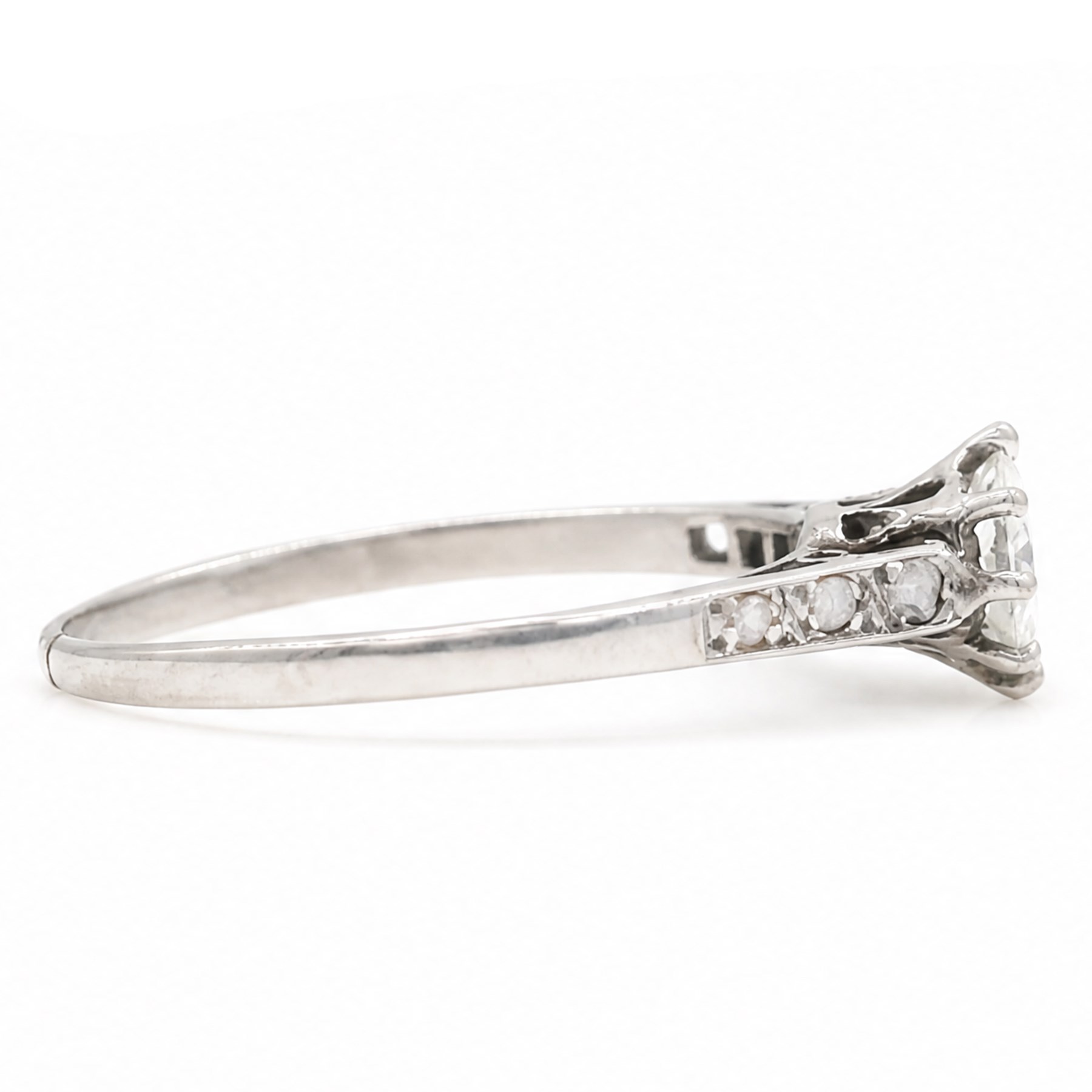 Early 20th century white gold and platinum diamond ring, eight claw set with a single old cut diamond of approx 0.70 carat and rose cut diamond shoulders, stamped PLAT 18ct