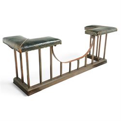 Early 20th century brass and buttoned green leather club fender with plain uprights 