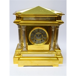  Large late Victorian brass mantel clock in the form of a Roman Temple, the break front top on six Corinthian column supports, circular silvered dial with applied Roman numerals, twin train movement stamped H.P & Co. 374, striking the half hours on a bell, with key and pendulum, H45cm, W39cm  