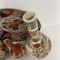 Collection of Japanese ceramics comprising pair of Satsuma vases decorated with panels depicting children and samurai figures, together with a Kutani vase painted with birds and flowers, all with painted character marks beneath, and an Imari plate, largest vase H31cm