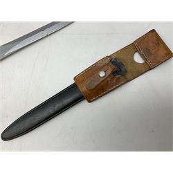 Swiss Model 1957 SIG rifle bayonet by Wenger with 23.5cm steel blade numbered 350857; in plastic scabbard with leather frog stamped GSCH 85 L38cm overall; and Egyptian Hakim rifle bayonet with the same script number to the grip and steel scabbard (2)