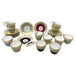 Twelve Spode Ruskin pattern coffee cups and saucers, with floral bouquets, varying colour grounds and gilt