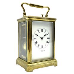 Early 20th century brass carriage clock with repeater, white enamel dial signed ‘Wilkinson, Paris’, twin train movement striking the hours and half on coil, with button repeater 