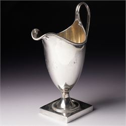George III silver helmet shape cream jug engraved with a monogram with loop handle on square base H15cm London  1790 Maker Hester Bateman