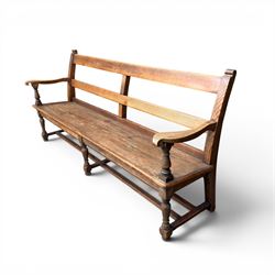 Early 20th century pine and oak bench seat, stained pine rail back frame with shaped oak arms