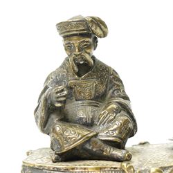 Early 19th century bronze 'go to bed' in the form of a seated Chinese figure on a rococo base W11cm and a plated on copper figure of a swordsman H12cm (2)