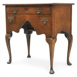 Early 20th century walnut lowboy in Queen Anne style, rectangular crossbanded top over single long drawer and two short drawers with shaped apron, fitted with brass drop handles and backplates, raised on cabriole supports terminating in pad feet