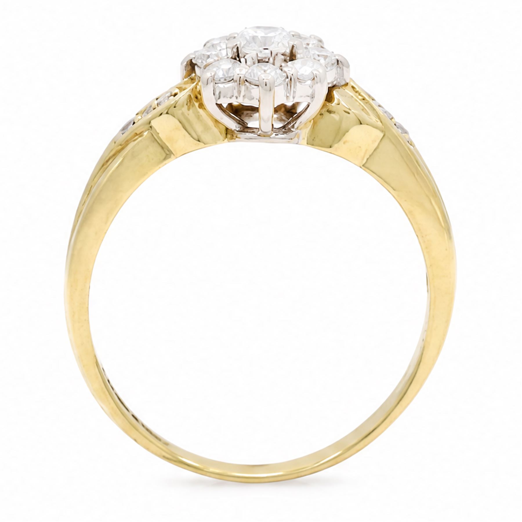 18ct gold diamond flower head cluster ring, set with nine round brilliant cut diamonds, with diamond set shoulders, London 1991, total diamond weight approx 0.40 carat