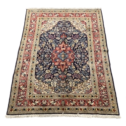 Persian Saroug rug, blue ground with interlacing foliate design, central medallion decorated with stylised flower heads, repeatin guarded border, 297cm x 196cm