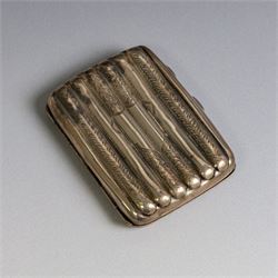 Two early 20th century silver cigarette cases, comprising a rectangular example with foliate decoration and vacant shield cartouche and a 1920s example with engine turned decoration and engraved initials, both hallmarked